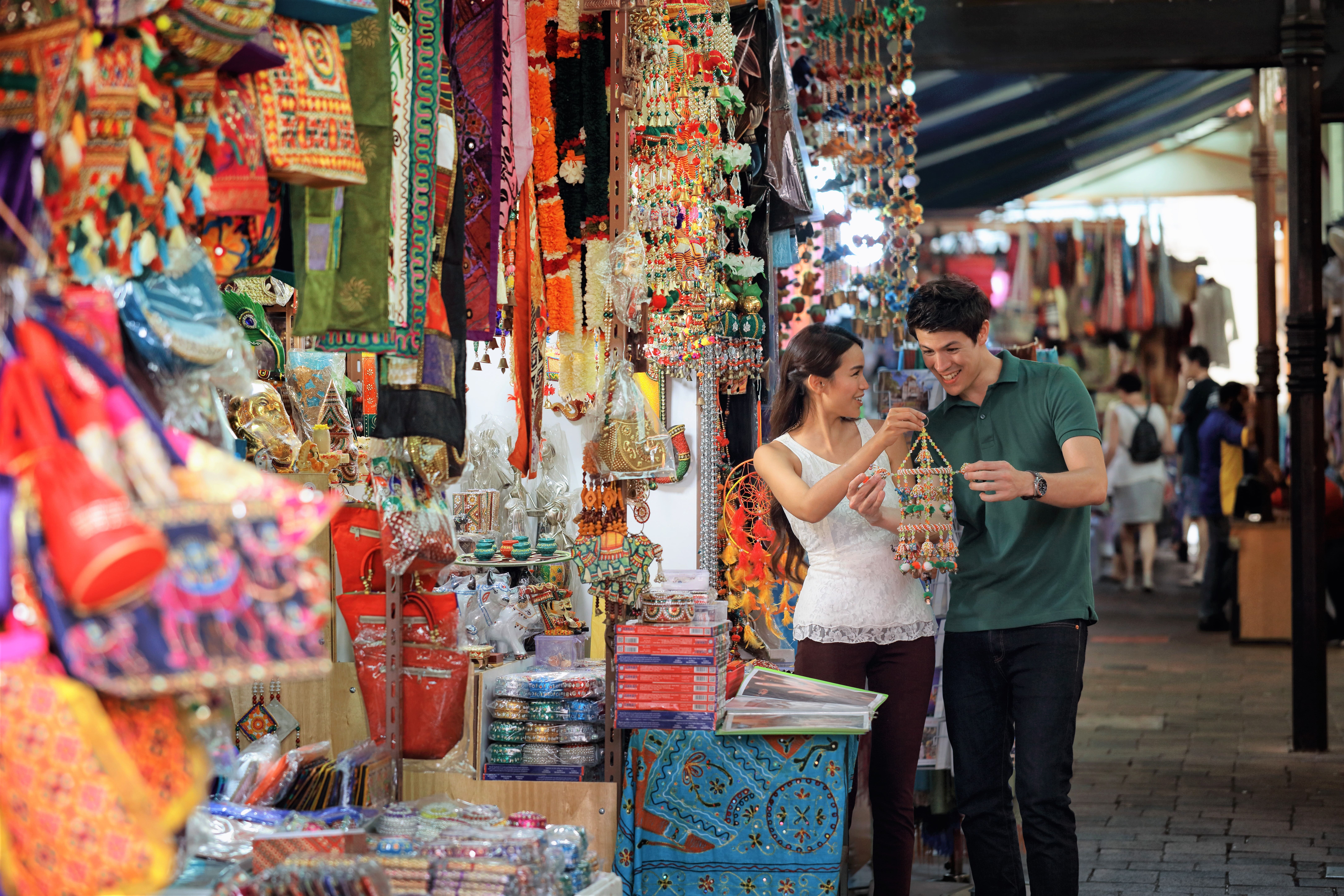A couple buying traditional decorations at a shop in Little India in Singapore